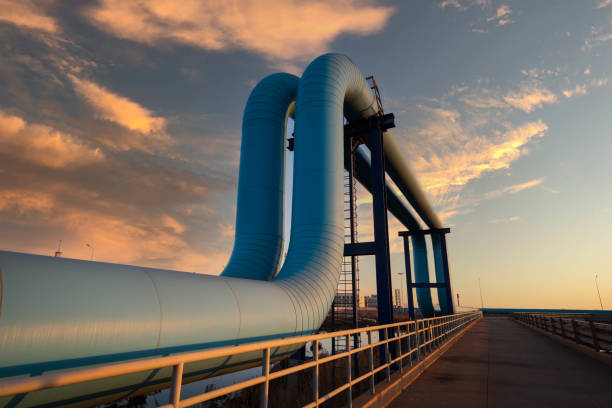 About Us oil pipeline in the sunset