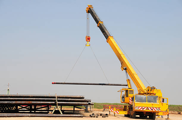 Services a lifting crane which is used to carry heavy loads in the oil and gas industry.